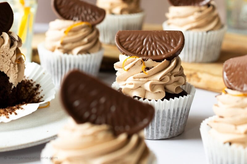 A row of Chocolate Orange Cupcakes with chocolate segments