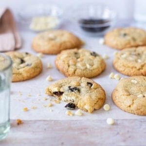 A White Chocolate and Cranberry Cookie on parchment paper
