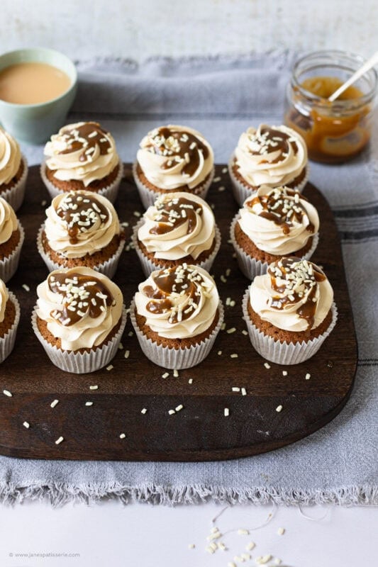 A baking tray of butterscotch cupcakes