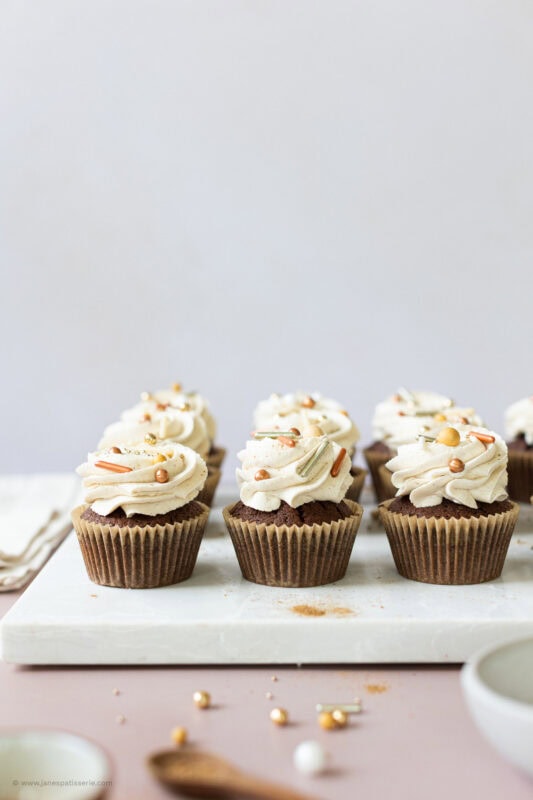 Many chocolate chai cupcakes fully decorated