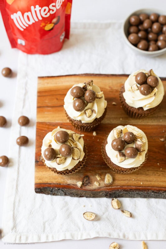 A top down shot of decorated malteser cupcakes
