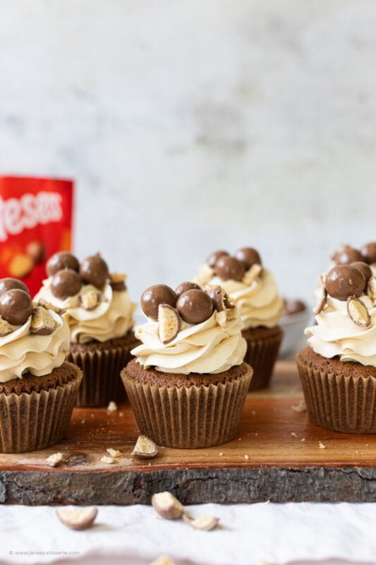 A row of decorated malteser cupcakes