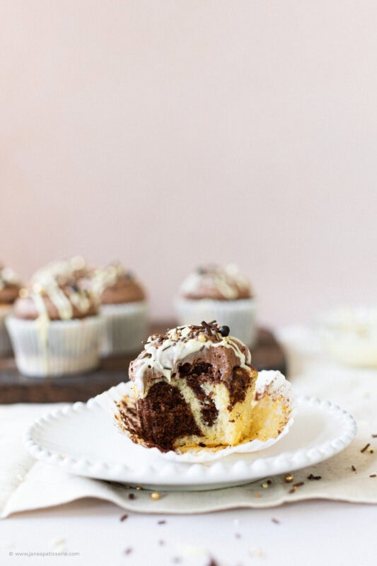 A bite missing from a marble cupcake