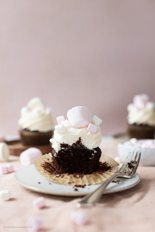 A bite taken from a marshmallow cupcake