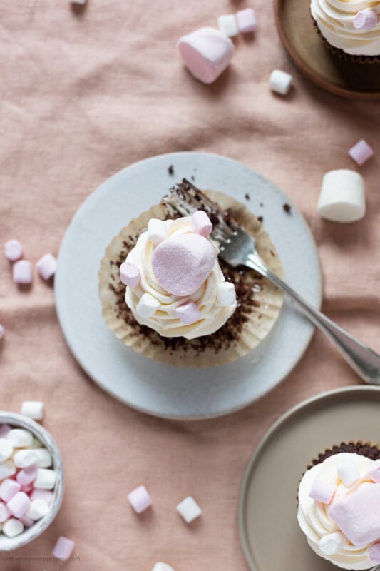 A top down shot of a marshmallow cupcake on a plate