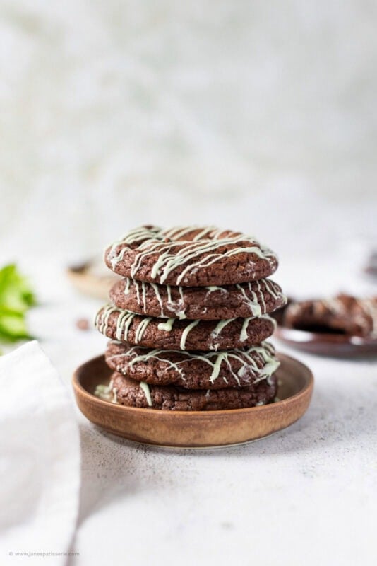 A stack of 5 mint chocolate cookies on a plate