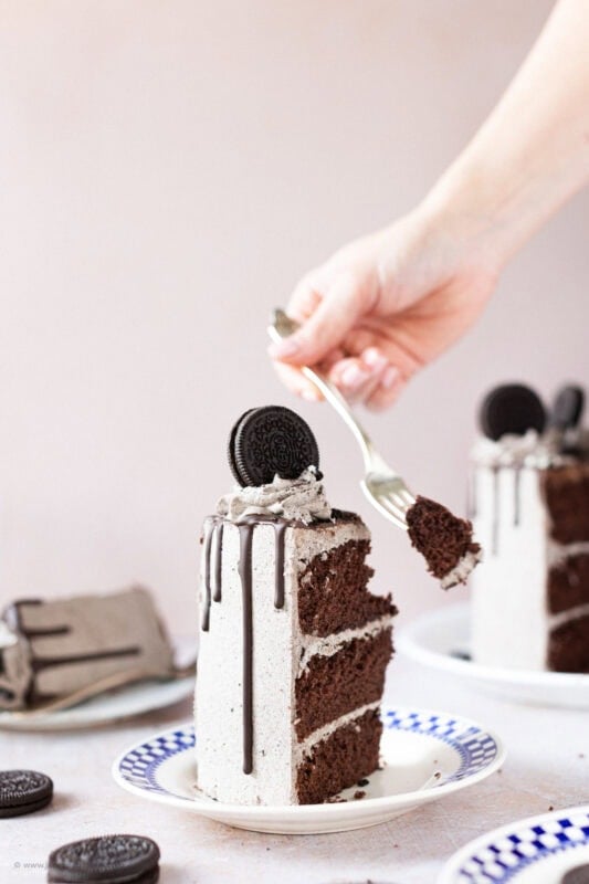 A fork cutting into an Oreo Drip Cake