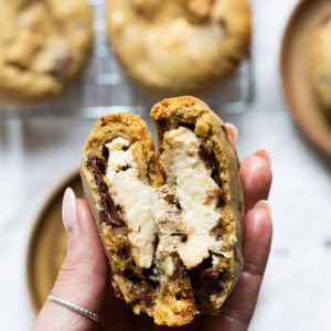 A hand showing a folded Salted Caramel Cheesecake Cookie