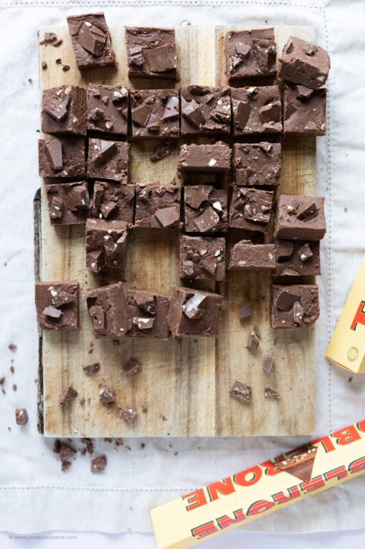A chopping board of Toberlone Fudge cut into chunks