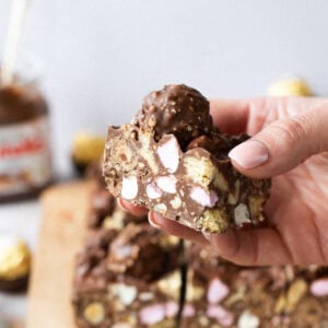 A hand holding Nutella Rocky Road at an angle