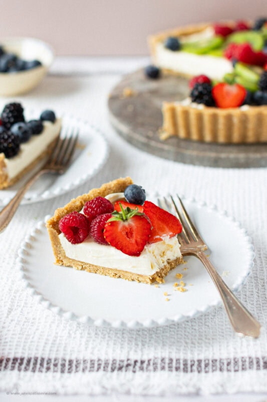 A bite taken from the Easy Fruit Tart slice.