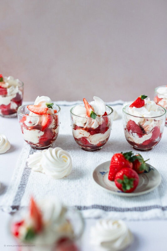 Eton mess' with homemade meringues lined up with fresh strawberries.