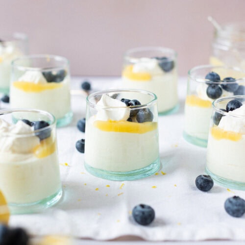 A batch of Lemon Curd Mousse surrounded by blueberries