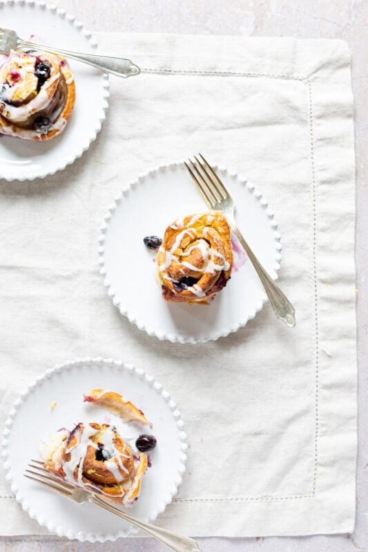 A lemon and blueberry roll on a plate