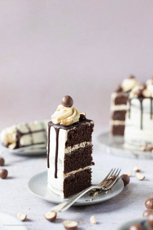 A half eaten slice of Malteser Drip Cake