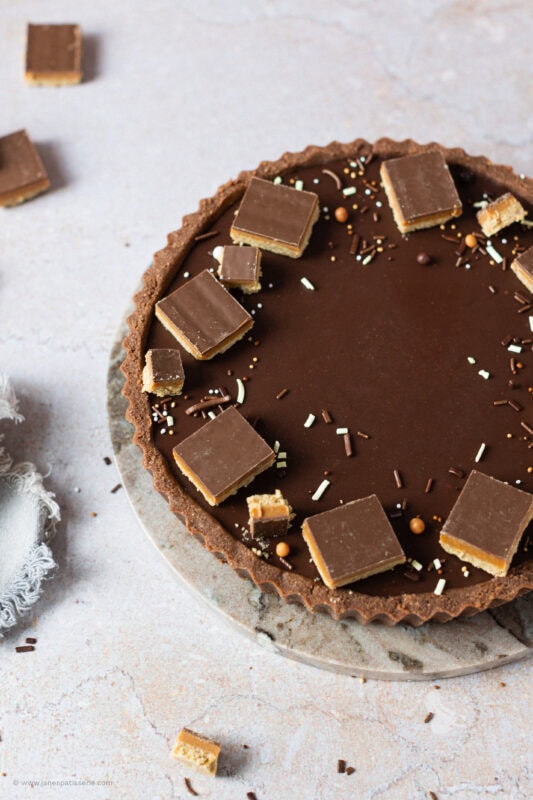 A whole Billionaires Tart on a chopping board