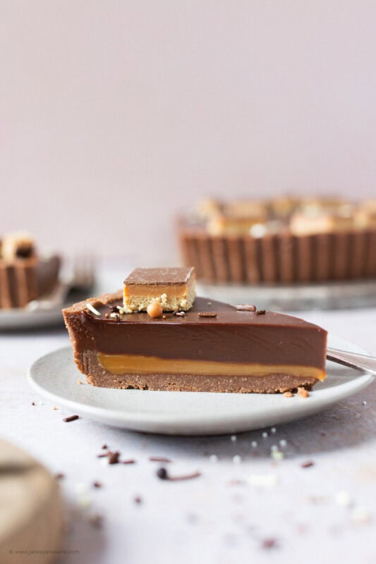 A slice of Billionaires Tart on a plate