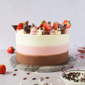 A whole Neapolitan Cake with clean icing around