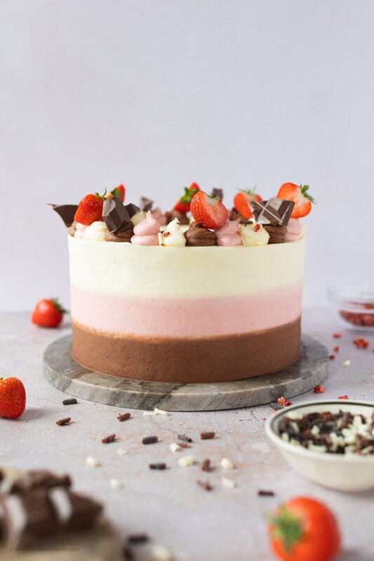 A whole Neapolitan Cake with clean icing around