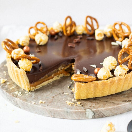 A slice missing from a Salted Caramel Tart
