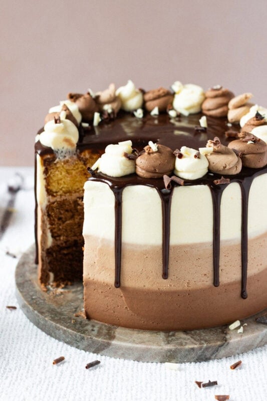 A slice missing from a Triple Chocolate Cake