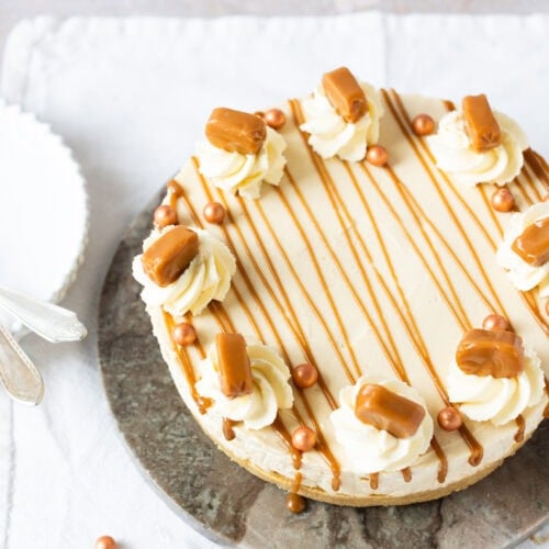A whole Butterscotch cheesecake on a serving board