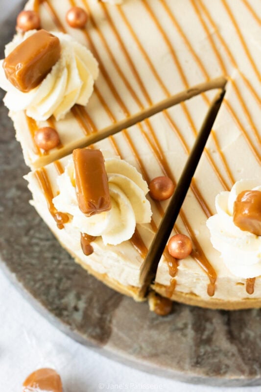A slice cut into a whole Butterscotch cheesecake