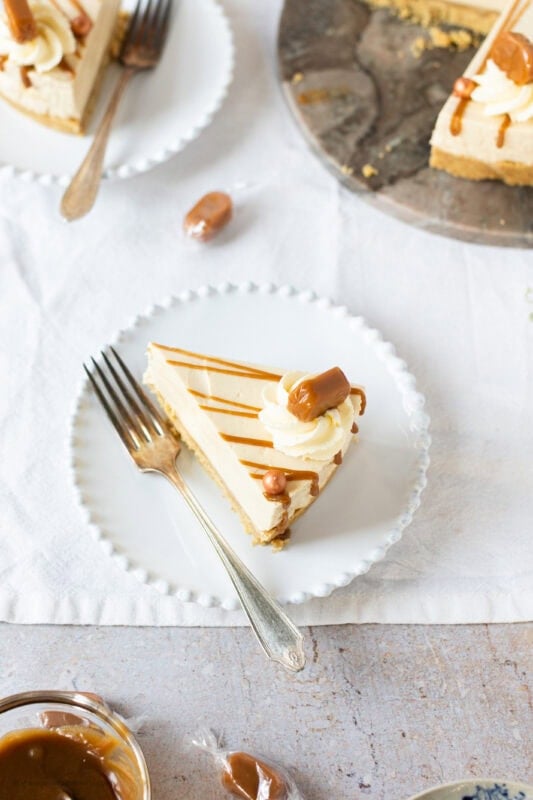A slice of Butterscotch cheesecake on a white plate