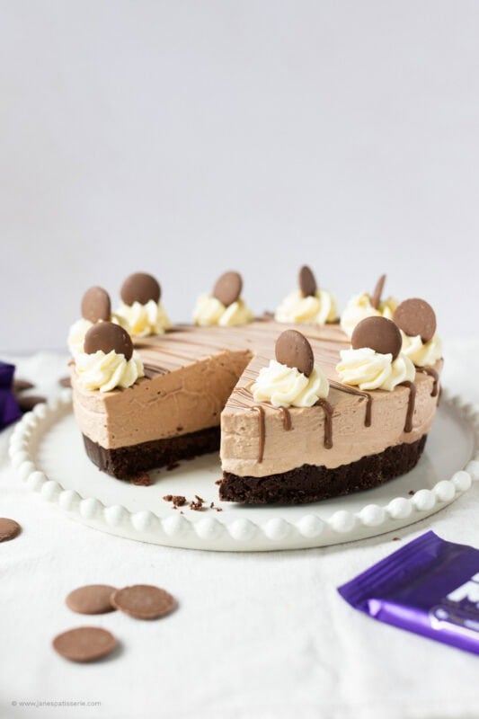 A slice missing from a Cadbury's chocolate cheesecake