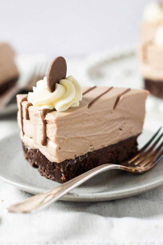 A slice of Cadbury Chocolate Cheesecake on a plate