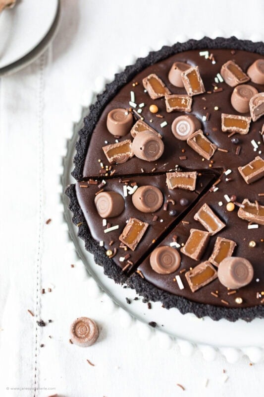 A slice cut into the no-bake Rolo tart