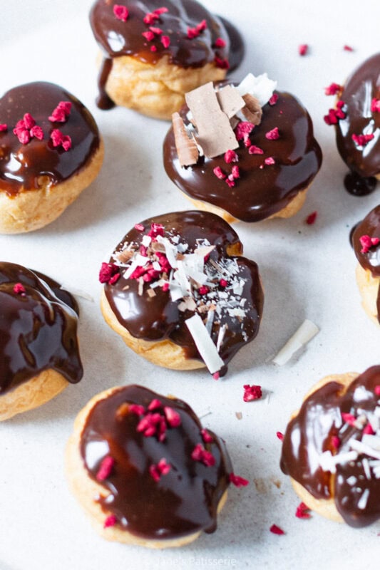 The middle profiterole from a pile on a plate