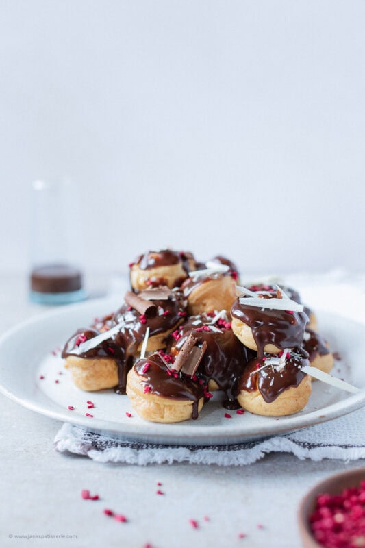 A closer shot of a plate of profiteroles.