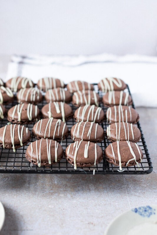 A cooling rack of Triple Chocolate Macarons