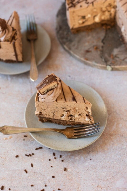 A slice of Double Decker Cheesecake on a plate
