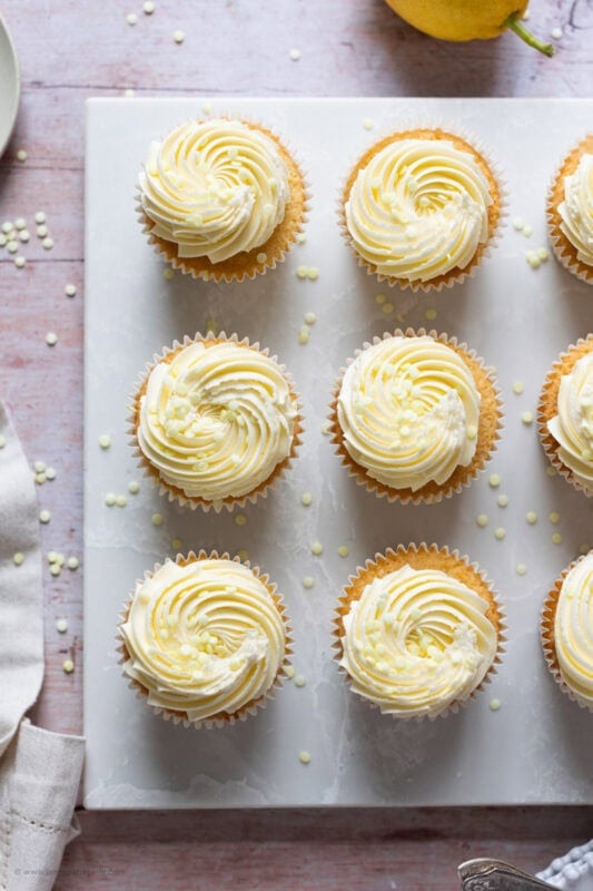 Top down shot of Lemon Drizzle Cupcakes on a chopping board