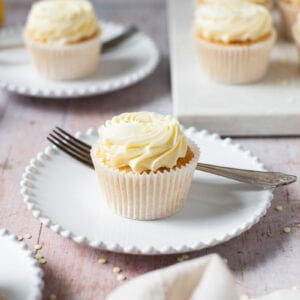 A Lemon Drizzle Cupcake on a white plate