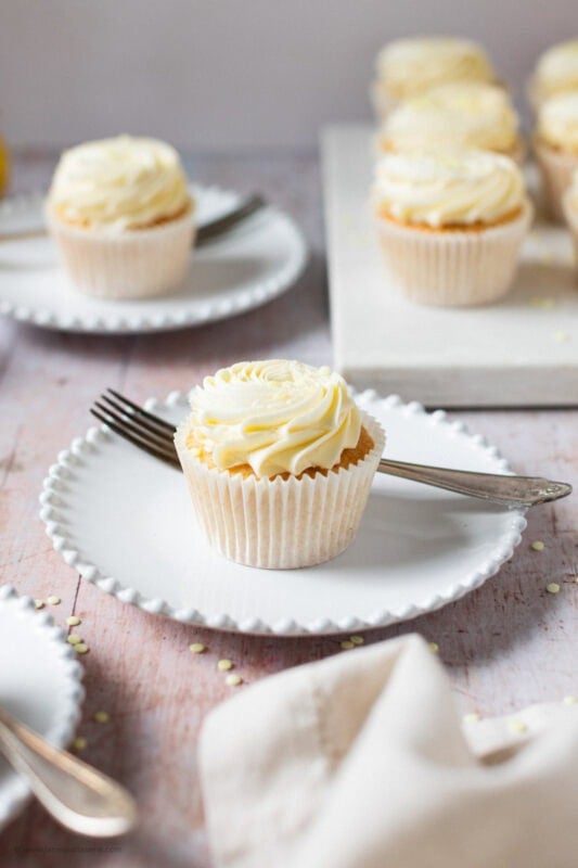A Lemon Drizzle Cupcake on a white plate