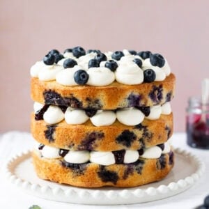 A whole Lemon Blueberry Cake on a serving dish