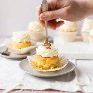 A fork cutting into a White Chocolate Cupcake