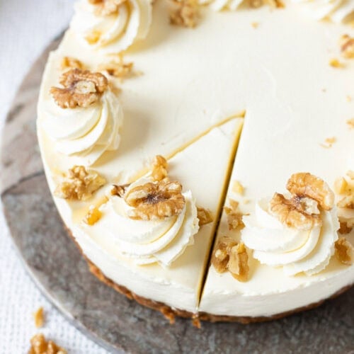 A slice cut into a whole Banana Bread Cheesecake