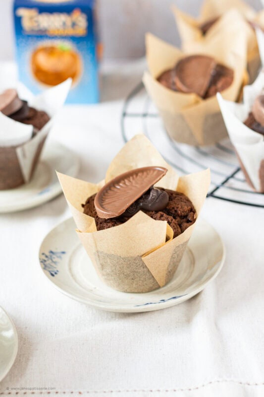 A single Chocolate Orange Muffin on a plate